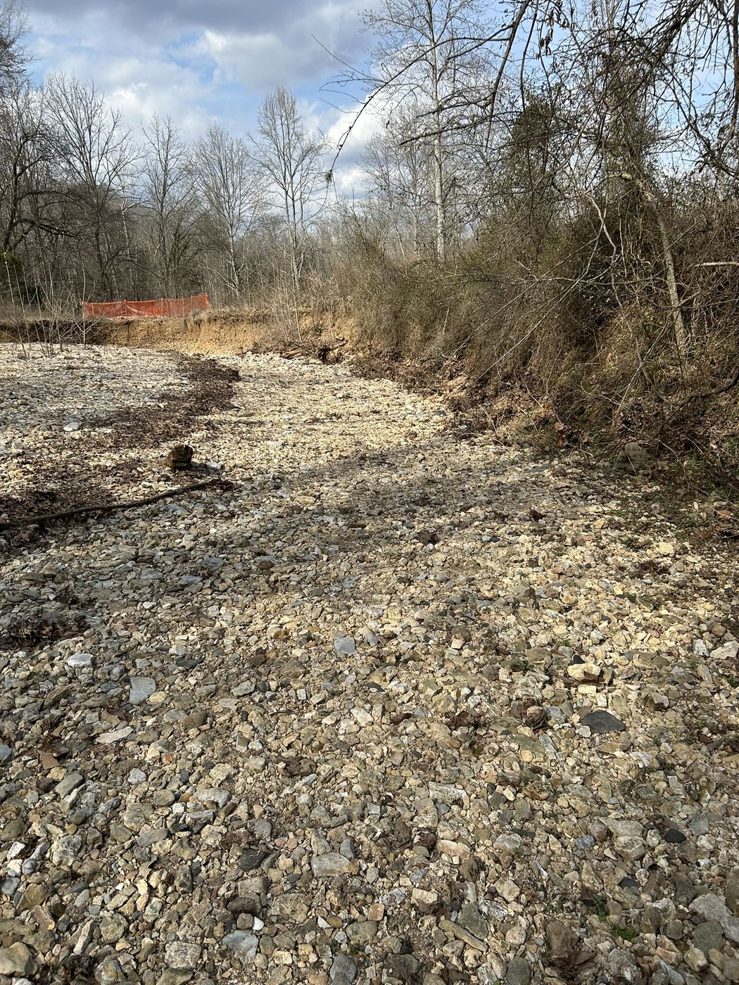 Pleasant Valley site before grading showing rocky soil and loose brush